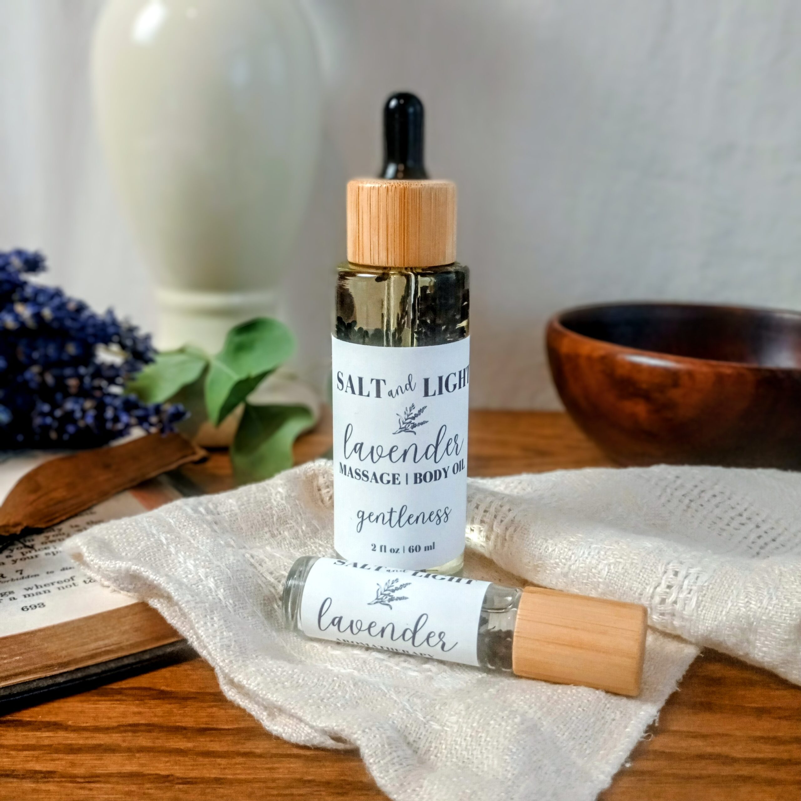 Lavender Massage Oil 2 oz bottle and 10 ml roller with bamboo lids from Abide Collection