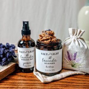 Fresh Lift Spring Self-Care Bundle by Salt + Light on cream linen background, featuring hydro mist, sugar scrub, and embroidered lavender sachet — curated gift for women’s relaxation and self-care.